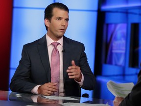 In this photo taken July 11, 2017, Donald Trump Jr. is interviewed by host Sean Hannity on his Fox News Channel television program, in New York. (AP Photo/Richard Drew)