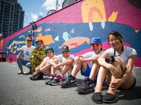Ottawa School of Art's Canada 150 Project Illunaata, which means "all together" in Inuktitut, unveiled the mural on the side of 87 George St. Sunday July 16, 2017. L-R Alexa Hatanaka (a guide for Embassy of Imagination) and the youth from Kinngait who created the mural Parr Josephee, Christine Adamie, Kevin Qimirpik, Harry Josephee and Janice Qimirpik.