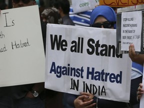 Over a hundred protesters held placards in protest of the recent killing of various religious groups in India in front of the Consulate General of India located in the Bloor and Sherbourne area on Sunday July 16, 2017. (Veronica Henri/Toronto Sun)