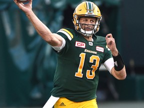 Edmonton Eskimos quarterback Mike Reilly (13) throws a pass against the Ottawa Redblacks during CFL action at Commonwealth Stadium in Edmonton, July 14, 2017. Ed Kaiser/Postmedia