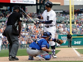 Detroit Tigers' Miguel Cabrera tosses his bat after being awarded a bases-loaded walk to defeat the Toronto Blue Jays in the 11th inning of a baseball game, Sunday, July 16, 2017, in Detroit. (AP Photo/Carlos Osorio)