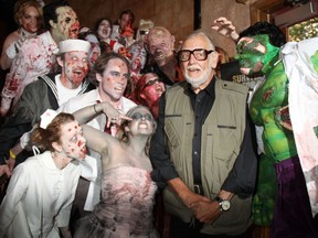 George A. Romero is surrounded by zombies at the premiere of 'Survival of the Dead' at Village East Cinema in New York City on May 16, 2010. (Credit: WENN)