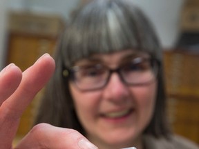 Janet Sperling holds a tick for a story about  the increase of ticks in Alberta and Lyme Disease as a result and what residents can do for safety and prevention on Wednesday May 31, 2017, in Edmonton.   Greg  Southam / Postmedia