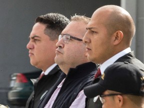 Mexico's former Veracruz state Gov. Javier Duarte is escorted in handcuffs by police to an aircraft as he is extradited to Mexico City at an Air Force base in Guatemala City, Monday, July 17, 2017. Duarte faces charges of embezzlement and ties to organized crime in his home country. (AP Photo/Moises Castillo)