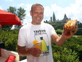 André Schad runs clothing boutiques in the ByWard Market and is also the entrepreneur behind Tavern on the Hill, a new summer patio in Major's Hill Park that sells hot dogs, ice cream and bar drinks. JEAN LEVAC / POSTMEDIA NETWORK