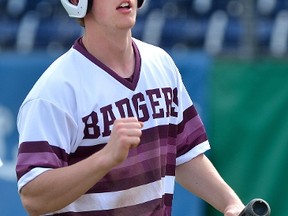 Will Pollard, 17, of London is not ready to chose between baseball ? he?s played eight years with the Badgers program ? and football. He?s a quarterback with his high school team. (MORRIS LAMONT, The London Free Press)