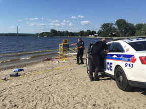 Ottawa police were at the scene after a man was found unresponsive in the water at Britannia Beach on Saturday, July 15, 2016. KELLY EGAN / POSTMEDIA