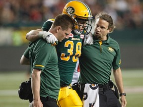 Edmonton Eskimos' Adam Konar (38) is injured against the Ottawa Redblacks during second half CFL action in Edmonton, Alta., on Friday July 14, 2017.