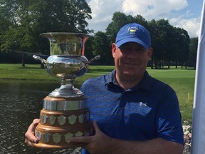 Robert Mackay of Orléans displays the Lord Alexander of Tunis after winning the Golf Quebec tournament at Rivermead on Monday.