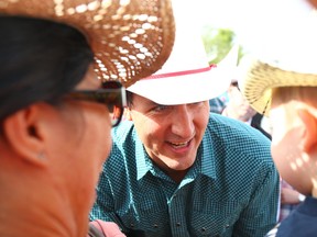 Prime Minister Justin Trudeau visits with Calgarians during a stop at Marda Loop Community Association for a pancake breakfast on Saturday, July 15, 2017. (Jim Wells/Postmedia)