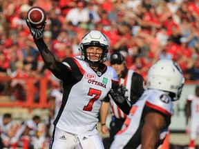 Redblacks quarterback Trevor Harris throws a pass against the Stampeders during first half CFL action at McMahon Stadium in Calgary on June 29, 2017. (Gavin Young/Postmedia Network)