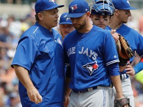 Toronto Blue Jays starting pitcher Marco Estrada listens to manager John Gibbons after being relieved during the fourth inning of a baseball game against the Detroit Tigers on July 16, 2017, in Detroit. (CARLOS OSORIO/AP)