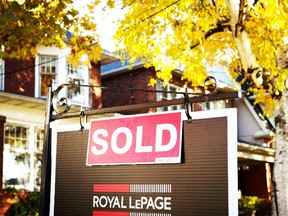 A real estate sold sign hangs in front of a west-end Toronto property, Friday, Nov. 4, 2016. (THE CANADIAN PRESS)