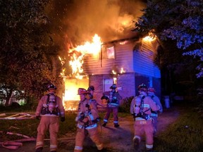 Ottawa firefighters at the scene of a blaze on Dynes Road early Tuesday.