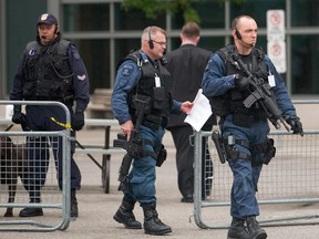 Heavily armed Canadian tactical officers. (Geoff Robins/AFP/Getty Images)