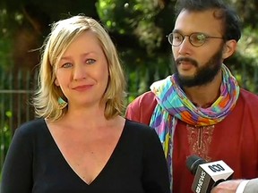 In this image made from video, Australia Greens party member of parliament, Sen. Larissa Waters, left, address a press conference as Greens Party councilor Jonathan Sri watches in Brisbane, Australia, Tuesday, July 18, 2017. (AuBC via AP)