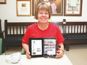 Bev Knutson-Shaw holds up one of five tablets with more than 40 video stories on a variety of different topics, but all to do with people from the Vulcan County. The tablets are at the Vulcan and District Historical Society.