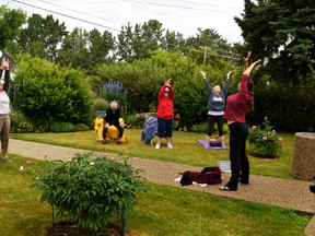 Ria Frith leads “meditationians” through a quick warm-up on the morning of July 11, to help loosen up bodies before the session started. Stephanie Hagenaars photo / Pincher Creek Echo