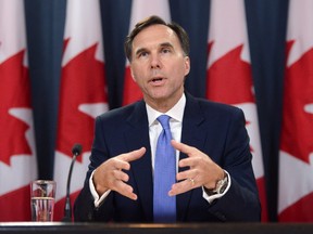 Minister of Finance Bill Morneau holds a press conference at the National Press Theatre in Ottawa on Tuesday, July 18, 2017. THE CANADIAN PRESS/Sean Kilpatrick