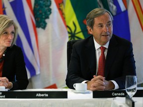 Rachel Notley (left/Premier of Alberta) and David MacNaughton (right/Canada's Ambassador to the United States) meet with Canada's provincial Premiers and National Indigenous Organization Leaders in Edmonton on Tuesday July 18, 2017.