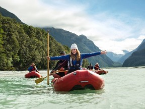 In this April 18, 2017, photo supplied by the Tourism New Zealand, United States actress Bryce Dallas Howard reacts as she enjoys a kayak trip down the Dart River in the Mt. Aspiring National Park, in New Zealand. Howard says her enthusiasm for New Zealand hasn't dimmed since she first visited at age 5 and was so stunned by the scenery she felt like she'd been transported to some other planet. The actress this week begins a campaign to promote the South Pacific nation as a tourist destination to Americans and Canadians. (Tourism New Zealand via AP)