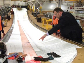 CHRIS ABBOTT/FILE PHOTO
Siemens Canada's Neil Brooks, plant manager at the wind blade manufacturing facility in Tillsonburg, explains part of the production process to a group of dignitaries and guests in April 2016.