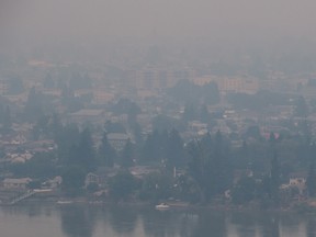 Smoke from wildfires burning in central B.C. shrouds the north shore of Kamloops, B.C., on Monday July 10, 2017. More than 200 wildfires are burning in the province and an estimated 14,000 people have been evacuated from their homes. (THE CANADIAN PRESS/Darryl Dyck)