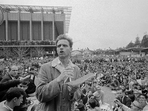 In this Dec. 7, 1964 file photo, Mario Savio, leader of the Berkeley Free Speech Movement, speaks to assembled students on the campus at the University of California in Berkeley, Calif. (AP Photo/Robert W. Klein, File)