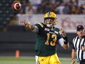 Edmonton Eskimos quarterback Mike Reilly (13) throws a pass against the Ottawa Redblacks during CFL action at Commonwealth Stadium in Edmonton, July 14, 2017.