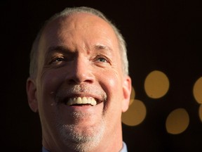 British Columbia Premier-designate, NDP Leader John Horgan smiles while speaking outside Government House after meeting with Lt-Gov. Judith Guichon in Victoria, B.C., on Thursday, June 29, 2017. (THE CANADIAN PRESS/Darryl Dyck)