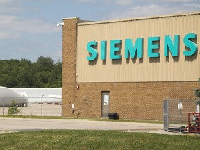 Giant wind turbine blades sit outside the Siemens plant in Tillsonburg, today it was announced the plant is closing putting more than 300 people out of work. (MIKE HENSEN, The London Free Press)