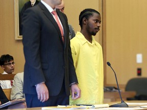 Marquest Hall, right, 17, is sentenced to 20 years in prison for the stabbing death of 52-year-old Antonio Muralles outside of Stamford’s downtown McDonalds in March 2015, during a sentencing hearing in Stamford Superior Court in Stamford, Conn., Tuesday, July 18, 2017. (Michael Cummo/Hearst Connecticut Media via AP)