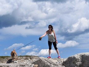 Victoria and Fidget take a breezy morning stroll along the breakwall of Meaford Marina. (BARBARA TAYLOR/POSTMEDIA NETWORK)