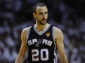 Manu Ginobili of the San Antonio Spurs looks on during the third quarter of Game 7 of the NBA Finals against the Miami Heat at the American Airlines Arena June 20, 2013 in Miami, Florida. (AFP PHOTO)