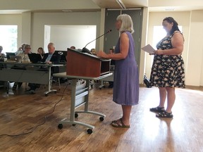 Louise Moody, executive director of the Northern Frontenac Community Services, left, and Gail Young of Frontenac Transportation Services speak to Frontenac County council in Glenburnie on Wednesday. (Elliot Ferguson/The Whig-Standard)