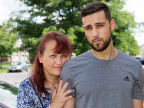 Adam Farsijani, seen here with his mother Renata, had his jaw broken during a violent attack on an OC transpo bus on the way back from Bluesfest last Thursday after the rowdy concert. Renata is frustrated with the way the incident was handled by authorities.  Wayne Cuddington/ Postmedia
