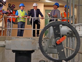 Mayor John Tory gets a tour of the R.C. Harris Water Treatment Plant with Lou Di Gironimo, general manager of Toronto Water, and plant manager Gordon Mitchell in Toronto on Wednesday, July 19, 2017. (DAVE ABEL/TORONTO SUN)
