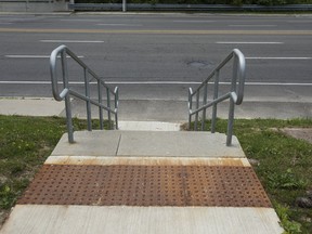 Stairs connecting Leaside Park to Millwood Rd. in Toronto on Wednesday, July 19, 2017. According to the city’s Parks, Forestry and Recreation department, the seven concrete steps with a metal railing cost $70,000. (ERNEST DOROSZUK/TORONTO SUN)