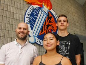 Summer session principal Steve Hedderson, left, with students Mariah Keeling and Brennan Laidman just after the mid-term of the summer school at Bayridge Secondary School on Wednesday. (Julia McKay/The Whig-Standard)
