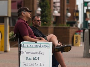 Dave Bona from Saskatchewan is a soldier who says he has suffered many side effects after taking the antimalarial drug mefloquine while in the military, and is protesting outside Canada Place on Wednesday July 19, 2017, in Edmonton. Greg Southam / Postmedia
