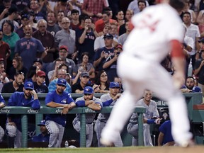 Toronto Blue Jays players watch Boston Red Sox relief pitcher Ben Taylor deliver during the ninth inning of an MLB game at Fenway Park in Boston on July 19, 2017. (AP Photo/Charles Krupa)