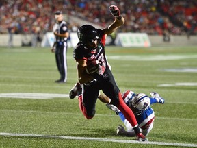 Ottawa Redblacks wide receiver Brad Sinopoli scores a touchdown past Montreal Alouettes defensive back Tyree Hollins during CFL action in Ottawa on July 19, 2017. (THE CANADIAN PRESS/Sean Kilpatrick)