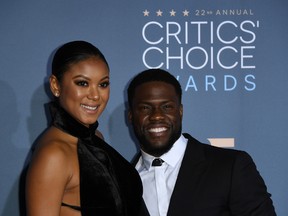 Eniko Parrish and actor Kevin Hart arrive for the 22nd Annual Critics' Choice Awards at the Barker Hangar in Santa Monica, California on December 11, 2016. (MARK RALSTON/AFP/Getty Images)