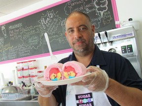 Martin Lacombe came up with the idea for cotton candy ice cream burritos at the Sugar, Sugar ice cream shop he opened in March with his wife Malynda on London Road in Sarnia, Ont. He's shown here Wednesday July 19 2017. The dessert's popularly has grown in recent weeks, fueled by online videos attracting millions of viewers. (Paul Morden/Sarnia Observer)