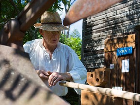 Tim Gray uses chisels to shape a new plow handle at O'Hara Mill Heritage Day on Sunday July 26, 2015 in Madoc, Ont. Tim Miller/Intelligencer File Photo