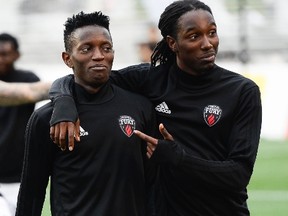 Fury FC players Azake Luboyera (left) and Jimmy-Shammer Sanon (right) walk together after the warm up at the friendly match between Fury FC and Montreal Impact held at TD Place in Ottawa on July 12, 2017. (James Park/Postmedia Network)