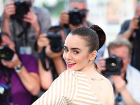 British actress Lily Collins poses on May 19, 2017 during a photocall for the film 'Okja' at the 70th edition of the Cannes Film Festival in Cannes, southern France. (ALBERTO PIZZOLI/AFP/Getty Images)