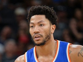 In this March 25, 2017, file photo, New York Knicks' Derrick Rose stands on the court during a free throw attempt in the first half of an NBA basketball game against the San Antonio Spurs, in San Antonio. (AP Photo/Darren Abate)