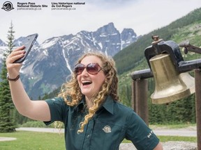 In this photo posted to Parks Canada's Facebook page on July 7, 2017, a young Parks Canada worker takes a selfie at Mount Revelstoke and Glacier national parks in British Columbia. (Facebook/Parks Canada)