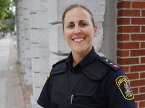 Belleville Police Insp. Sheri Meeks stands on Front Street Thursday, July 20, 2017 in Belleville, Ont. She recently scored 100 per cent on her Ontario Police Fitness Award test, a voluntary but difficult physical exam. The Belleville Police Service has Ontario's highest per-capita ratio of officers who've passed the test, Chief Ron Gignac said. Luke Hendry/Belleville Intelligencer/Postmedia Network